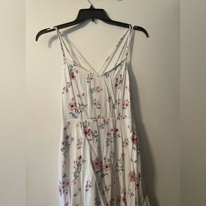 Pretty White floral dress with pockets and a  criss cross back from GARAGE
